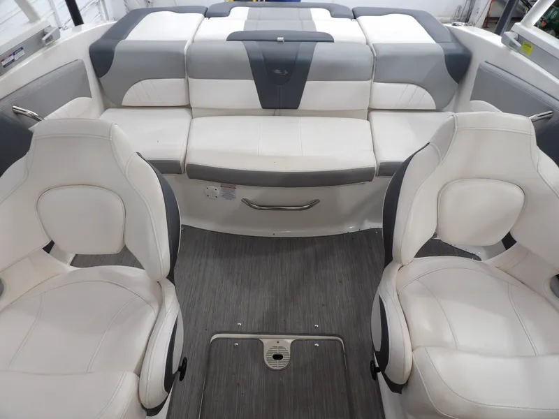 Slide: The Image of Interior of a 2021 Chaparral 21 SSi with white and gray seating. - 17