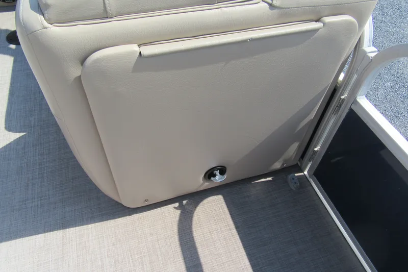 Slide: The Image of 2019 SUNTRACKER 20 DLX PARTY BARGE interior seating detail with beige upholstery. - 14