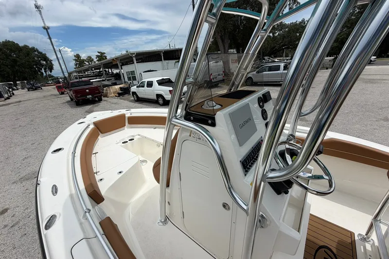 Slide: The Image of 2025 Key West 219 FS boat with Garmin navigation, parked in a marina. - 35