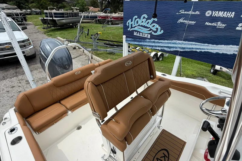 Slide: The Image of 2025 Key West 219 FS boat interior with tan seating at Holiday Marine display. - 22