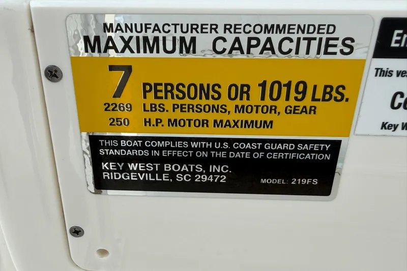 Slide: The Image of 2025 Key West 219 FS boat capacity label: 7 persons or 1019 lbs, 250 HP max. - 29