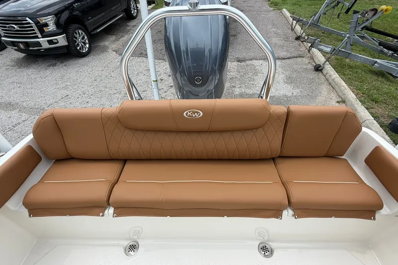 Slide: The Image of 2025 Key West 219 FS boat with tan leather seating and stainless steel railing. - 8