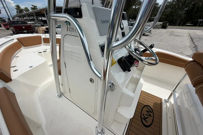 Slide: The Image of 2025 Key West 219 FS boat interior with steering console and seating. - 19