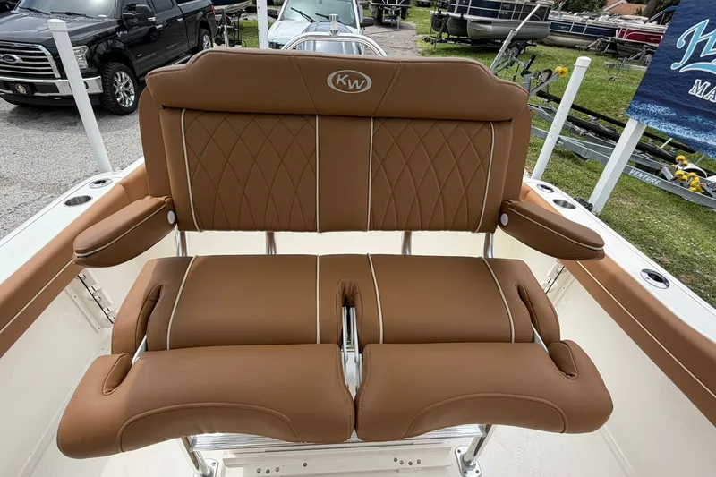 Slide: The Image of Brown leather seating on 2025 Key West 219 FS boat, featuring diamond stitching and armrests. - 20
