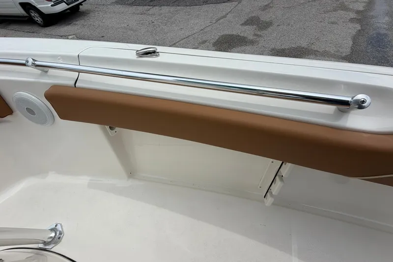 Slide: The Image of Interior view of 2025 Key West 219 FS boat, featuring sleek railing and cushioned seating. - 26