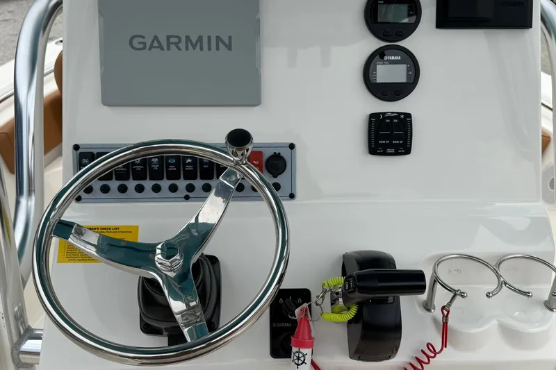 Slide: The Image of Steering console of 2025 Key West 219 FS boat with Garmin navigation system. - 25