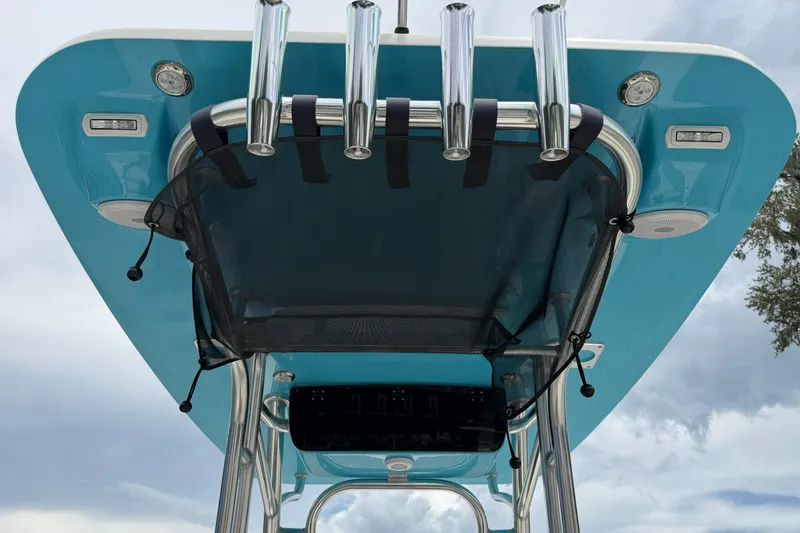 Slide: The Image of T-top view of 2025 Key West 219 FS boat with rod holders and netting. - 34