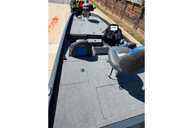 Slide: The Image of 2023 Ranger RT198P fishing boat interior with seating and steering console. - 3