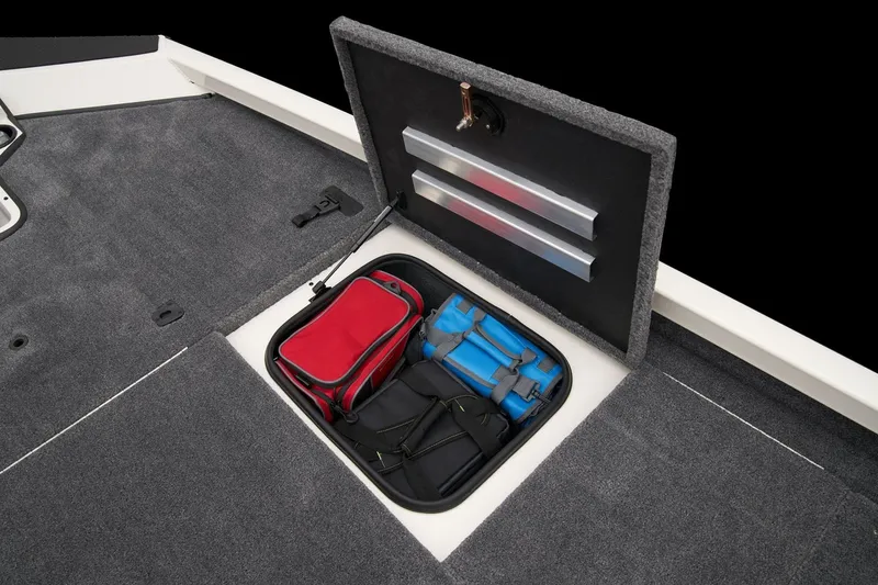 Slide: The Image of 2023 Ranger RT198P boat storage compartment with red and blue bags. - 11
