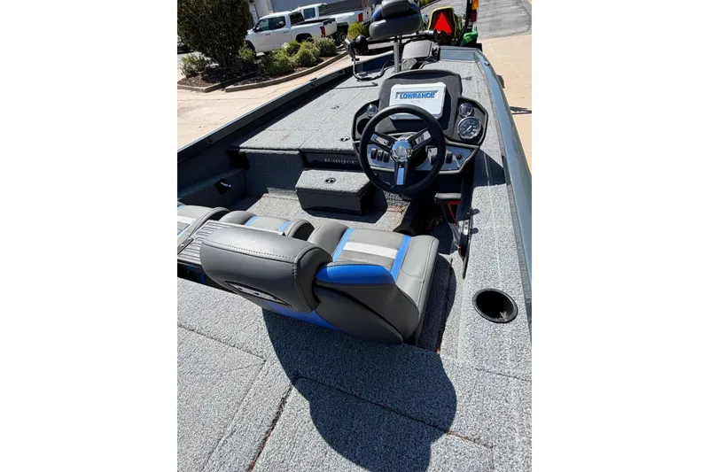 Slide: The Image of 2023 Ranger RT198P boat interior with steering wheel and seating. - 2