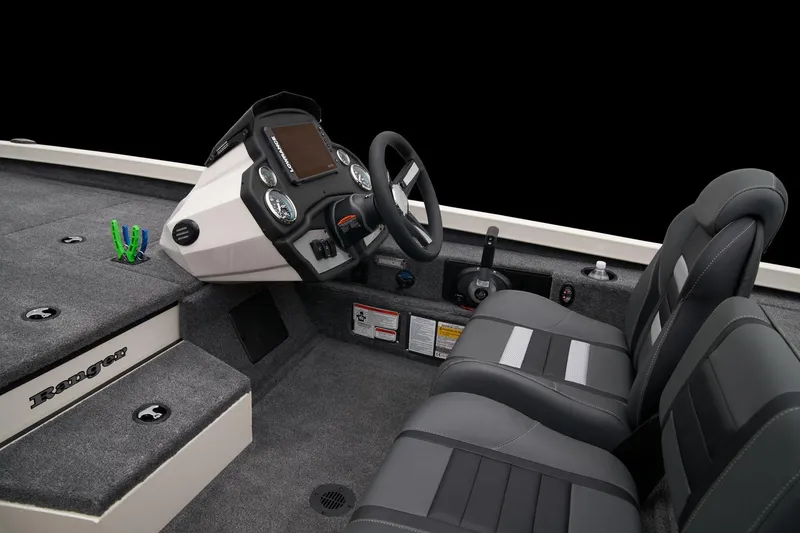 Slide: The Image of 2023 Ranger RT198P boat interior with steering console and dual seats. - 5