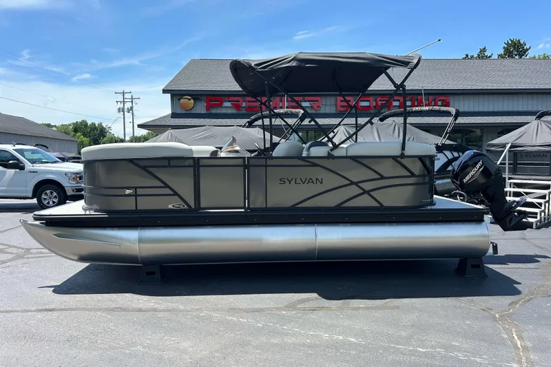 Slide: The Image of 2026 Sylvan Mirage 820 LZ pontoon boat displayed at Premier Boating dealership. - 15