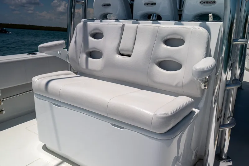 Slide: The Image of Contender 39 ST 2025 boat seating with white cushioned bench and armrests on deck. - 18