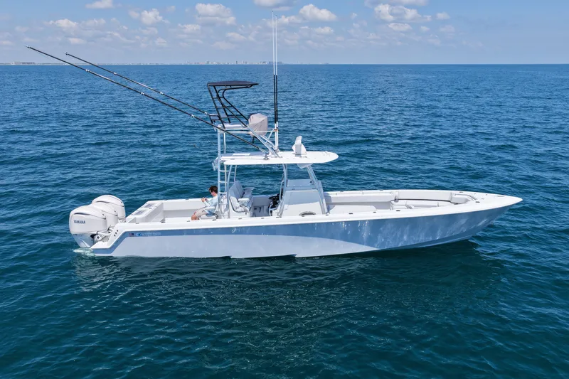 Slide: The Image of 2025 Contender 39 ST boat on open ocean with clear skies. - 5