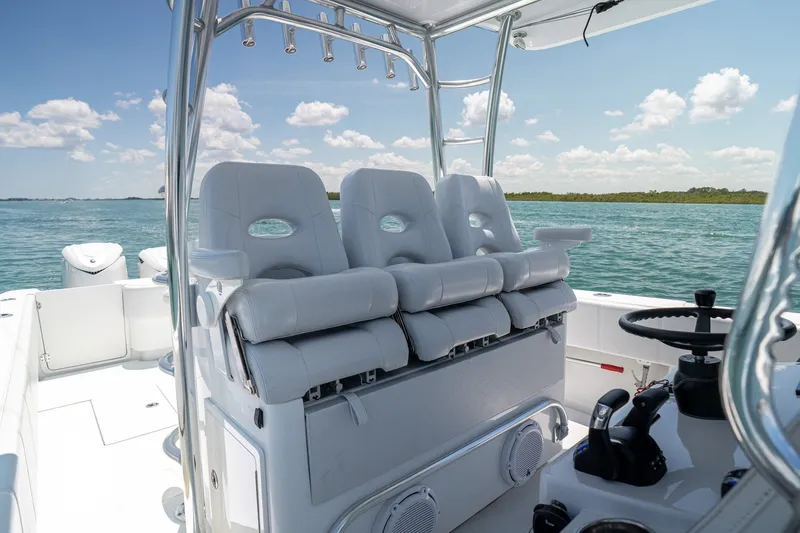 Slide: The Image of 2025 Contender 39 ST boat interior with plush seating and ocean view. - 25