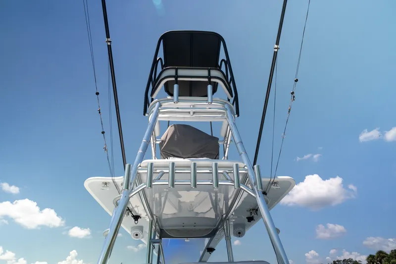 Slide: The Image of Tower view of 2025 Contender 39 ST boat against a clear blue sky. - 12