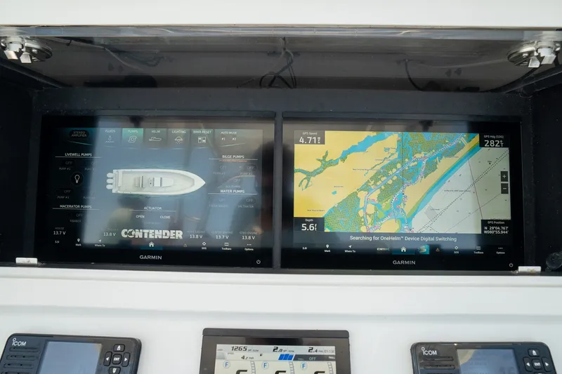 Slide: The Image of Dashboard of 2025 Contender 39 ST boat with Garmin navigation displays. - 19