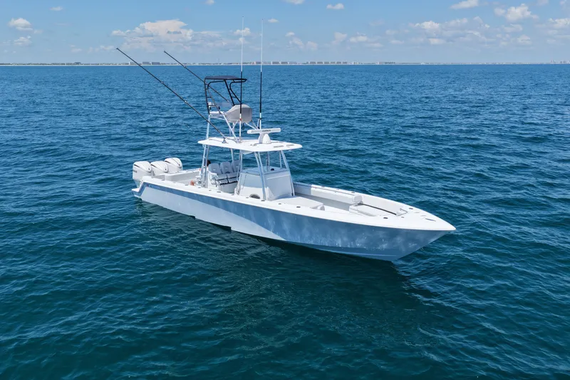 The Image of 2025 Contender 39 ST boat on open ocean under clear blue sky. - 0