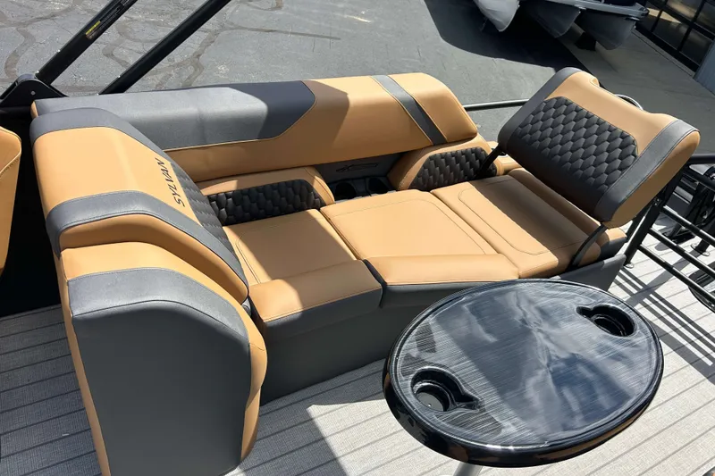 Slide: The Image of Luxurious seating on 2027 Sylvan X3 LZ DH Tritoon with sleek table and cup holders. - 3