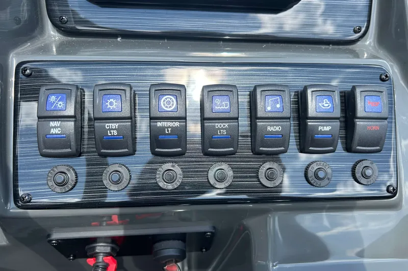 Slide: The Image of Control panel of 2027 Sylvan X3 LZ DH Tritoon with labeled switches. - 15