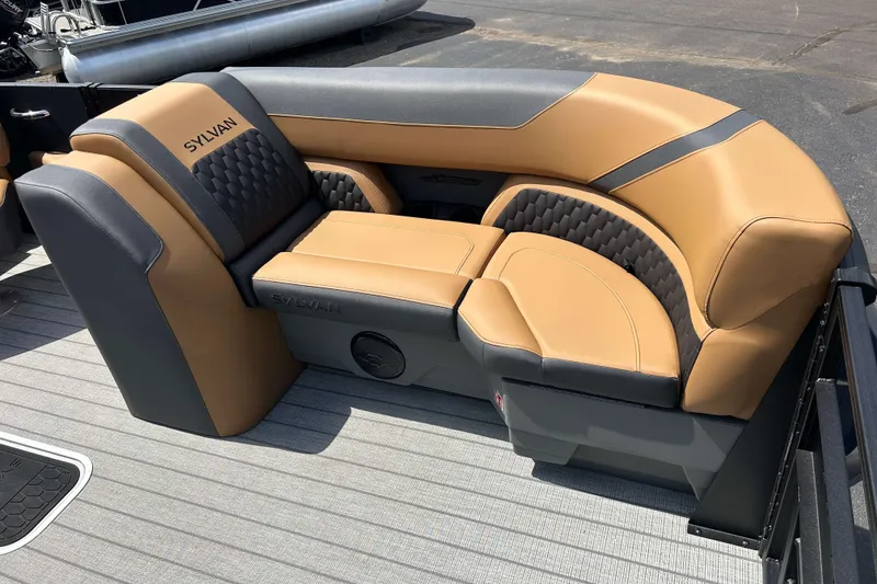 Slide: The Image of Luxurious seating on 2027 Sylvan X3 LZ DH Tritoon boat, featuring tan and gray upholstery. - 19