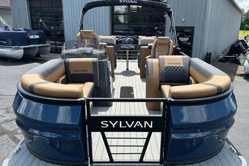 Slide: The Image of 2027 Sylvan X3 LZ DH Tritoon with luxurious seating and sleek design. - 1