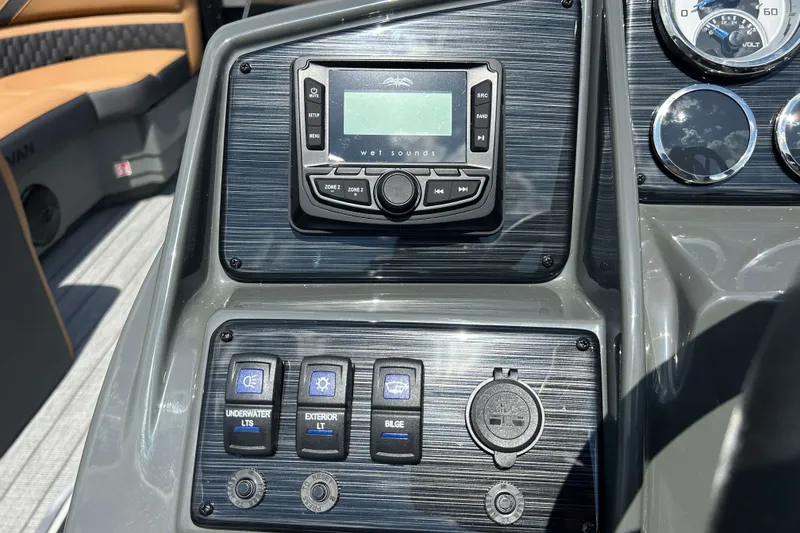 Slide: The Image of Control panel of 2027 Sylvan X3 LZ DH Tritoon with audio system and switches. - 14