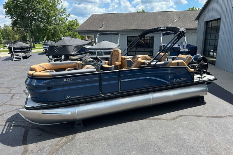 The Image of 2027 Sylvan X3 LZ DH Tritoon boat with sleek design, parked outdoors. - 0