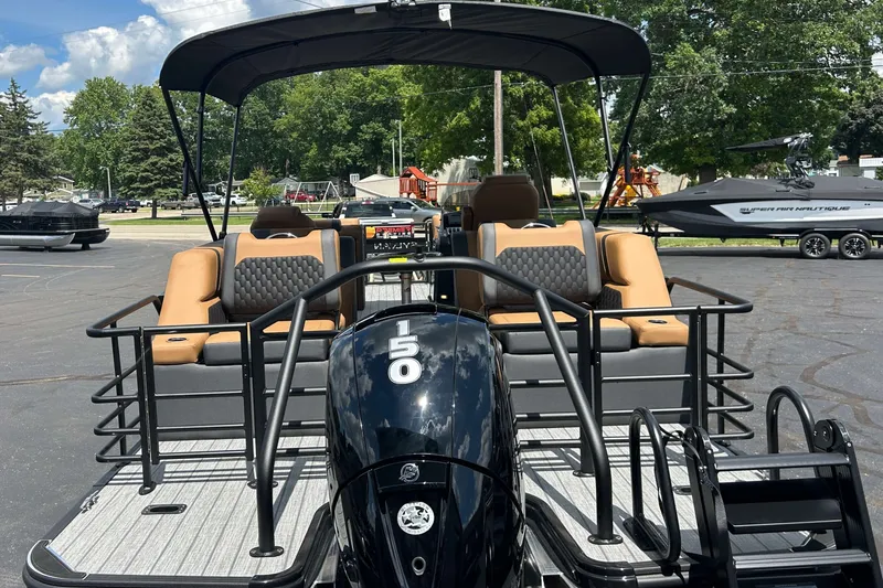 Slide: The Image of 2027 Sylvan X3 LZ DH Tritoon with 150 HP engine, parked outdoors. - 24