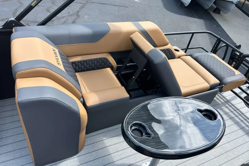 Slide: The Image of Luxurious seating on 2027 Sylvan X3 LZ DH Tritoon with sleek table and cup holders. - 5