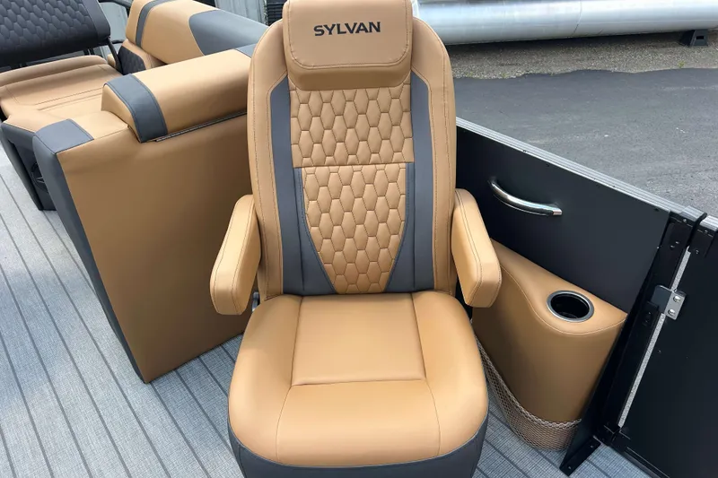 Slide: The Image of Luxurious tan and gray captain's chair on 2027 Sylvan X3 LZ DH Tritoon boat. - 9