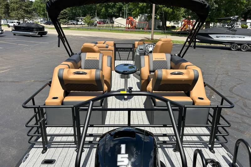 Slide: The Image of 2027 Sylvan X3 LZ DH Tritoon with luxurious seating and sleek design. - 2
