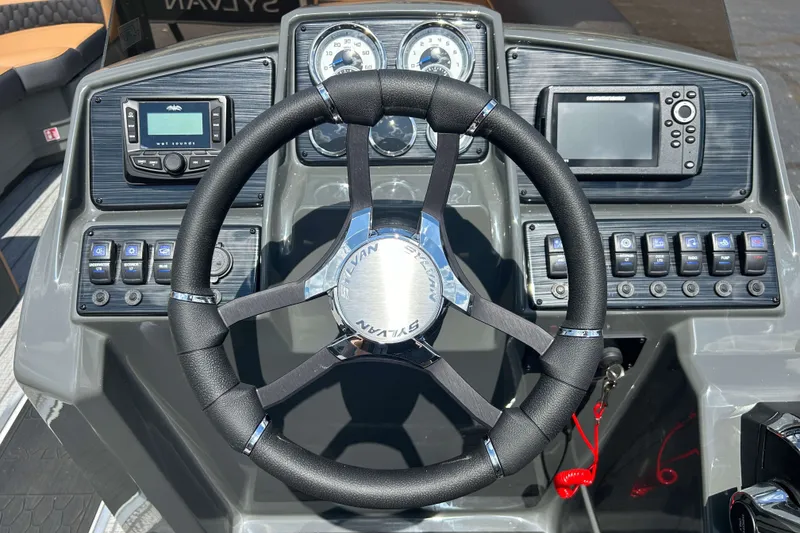 Slide: The Image of Steering wheel and dashboard of 2027 Sylvan X3 LZ DH Tritoon boat. - 12