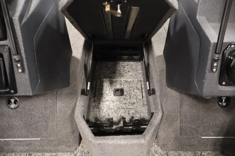 Slide: The Image of 2025 Tracker Targa 18 WT boat interior storage compartment, open and empty. - 21