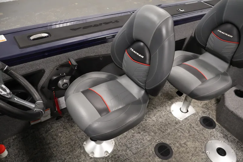 Slide: The Image of Interior of 2025 Tracker Targa 18 WT boat with gray and red seats. - 32
