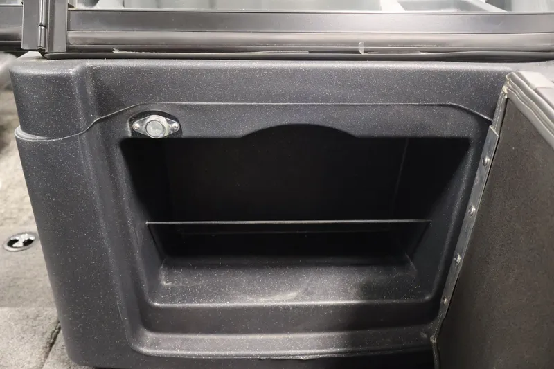 Slide: The Image of Storage compartment in 2025 Tracker Targa 18 WT boat interior. - 19