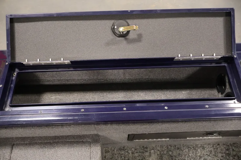Slide: The Image of Open storage compartment in 2025 Tracker Targa 18 WT boat. - 37