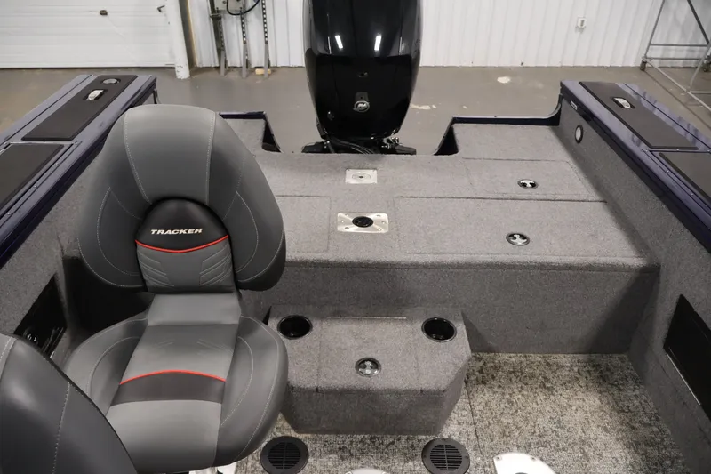 Slide: The Image of Interior of 2025 Tracker Targa 18 WT boat with gray seating and carpeted deck. - 36