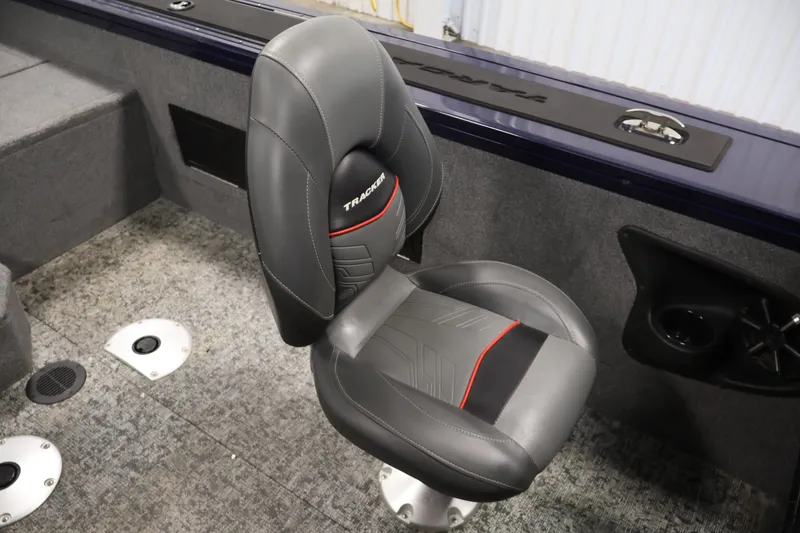 Slide: The Image of 2025 Tracker Targa 18 WT boat seat with gray upholstery and red accents. - 35
