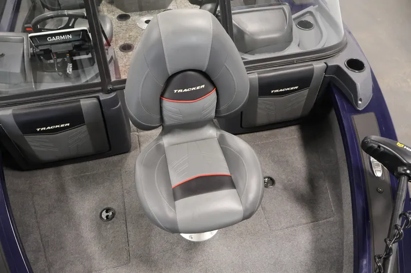 Slide: The Image of 2025 Tracker Targa 18 WT boat interior with Garmin system and comfortable seating. - 14