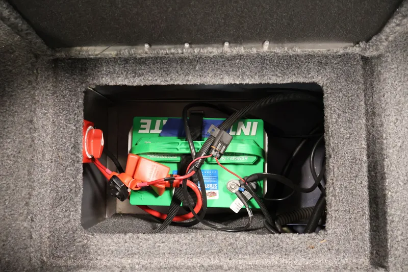 Slide: The Image of Battery compartment of 2025 Tracker Targa 18 WT boat, featuring wiring and connections. - 42