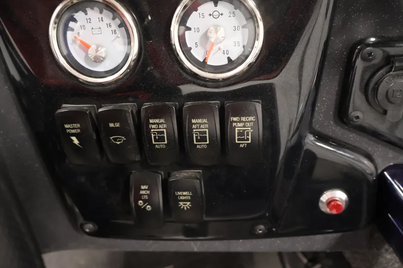 Slide: The Image of Control panel of 2025 Tracker Targa 18 WT boat with gauges and switches. - 29