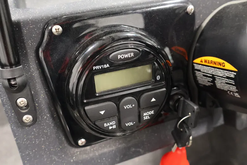 Slide: The Image of Control panel of 2025 Tracker Targa 18 WT boat with power and volume buttons. - 30