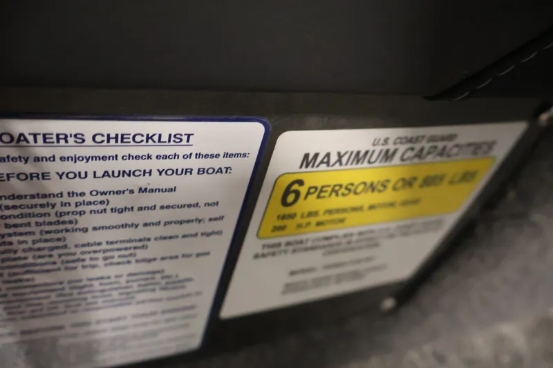 Slide: The Image of Boater's checklist and capacity label on 2025 Tracker Targa 18 WT boat. - 31