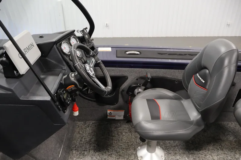 Slide: The Image of Interior of 2025 Tracker Targa 18 WT boat with steering wheel and Garmin device. - 22