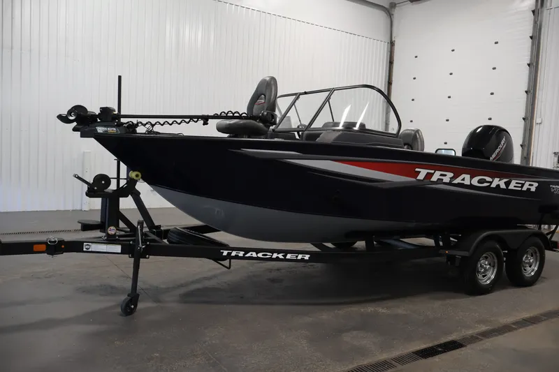 Slide: The Image of 2025 Tracker Targa 18 WT boat on trailer in indoor setting. - 52