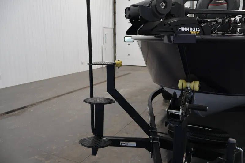 Slide: The Image of 2025 Tracker Targa 18 WT boat with Minn Kota Terrova motor in a garage. - 50