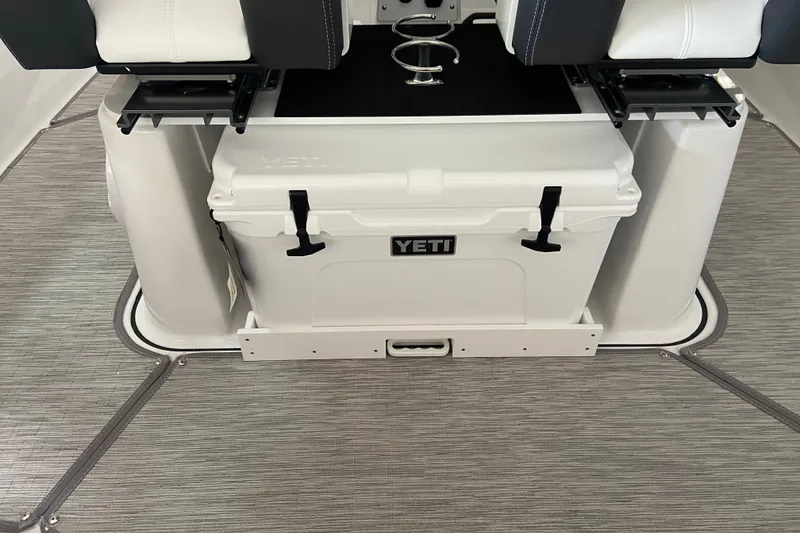 Slide: The Image of YETI cooler on 2027 Monterey Elite 25 OB boat with cushioned seating. - 7