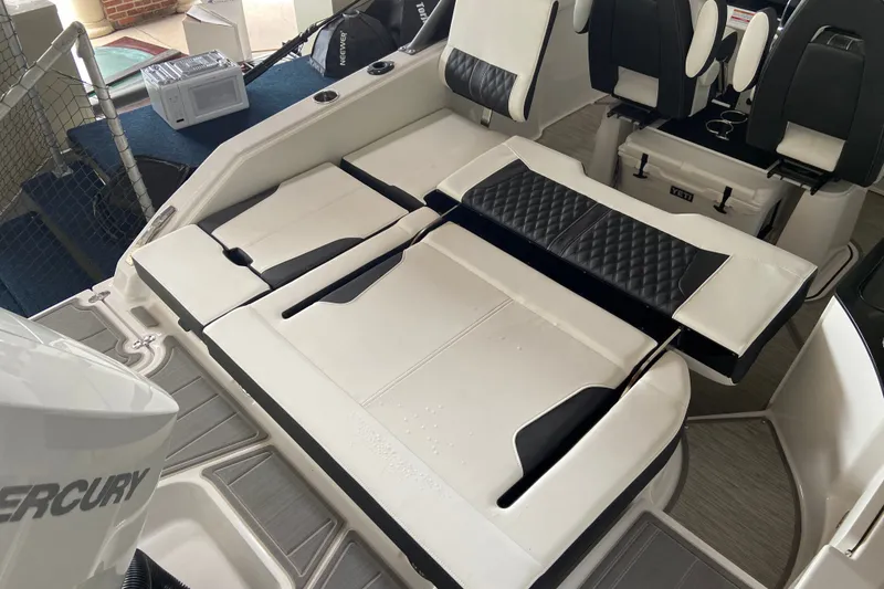 Slide: The Image of Interior of 2027 Monterey Elite 25 OB boat with white and black seating. - 5