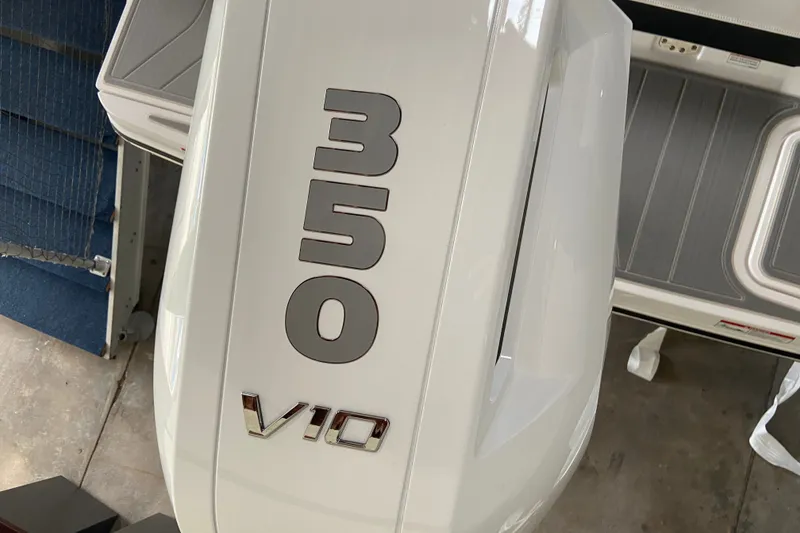 Slide: The Image of Close-up of a white outboard motor labeled "350 V10." - 1